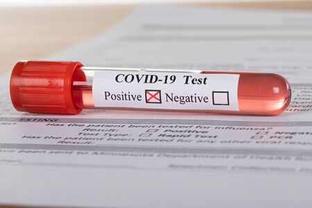 Close up picture of covid-19 blood test and fill in form