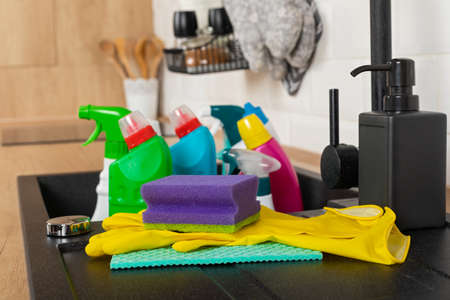 Colorful cleaning products in the kitchenの写真素材
