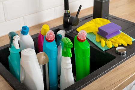 Colorful cleaning products in the kitchenの写真素材