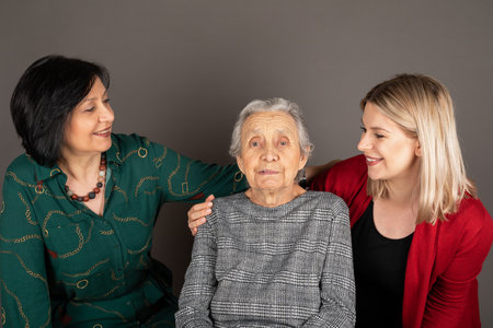 Picture of happy women generations in a family - granddaughter, mother and grandmother - indoor...