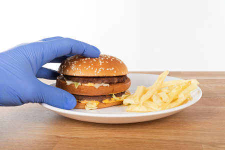 Home delivery burger in time of coronavirus quarantine - covid-19