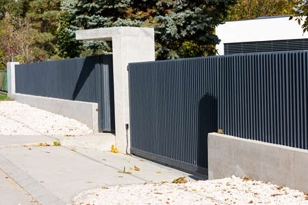 Close up picture of modern property fence - entrance, family house in Budapest, Hungary