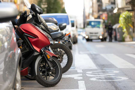 Picture of motorbike, motorcycle scooters parked in city streetの写真素材