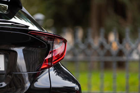 Close up picture of shiny modern car in the parking space in city  downtownの写真素材
