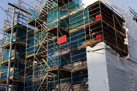 Scaffolding steel frame installation on a construction siteの写真素材