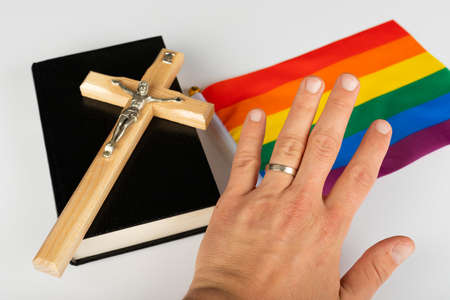 Picture of a bible, cross and a rainbow flagの写真素材