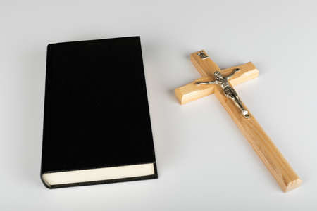 Holy Bible and cross on white background with copy spaceの写真素材