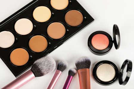 Close up picture of make up products and accessories, contour palette, brushes on white backgroundの写真素材