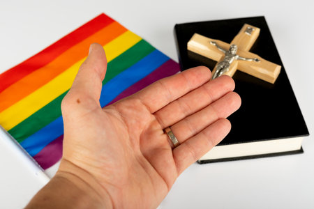 Picture of a bible, cross and a rainbow flagの写真素材