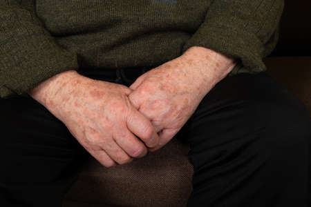 Close up picture of a senior man's handsの写真素材