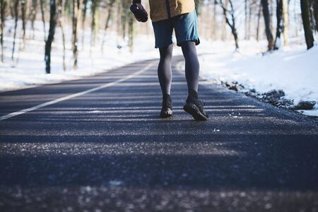 Athletic young man running in the nature. Healthy lifestyle - burning caloriesの写真素材