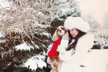 Young beautiful woman drinking latte in coffee shopの写真素材