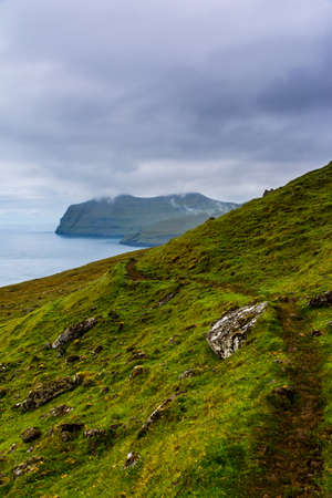 Rugged mountain landscape in Faroe Islands during summerの写真素材