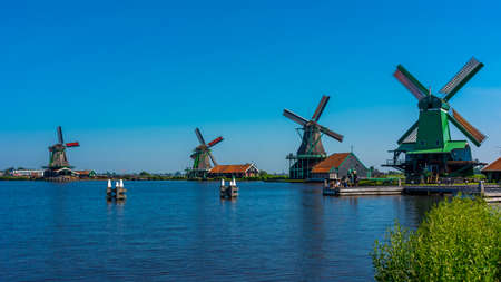 Traditional wooden windmills near Amsterdam in the village of Zaanse Schansのeditorial素材