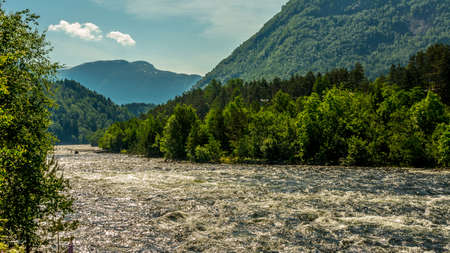 fast flowing mountain river in summer time near Eidfjord, Norwayの写真素材