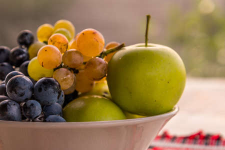small bowl with autumn seasonal fruitsの写真素材