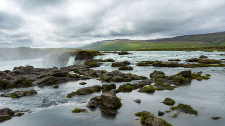 Detail of the majestic Godafoss waterfall near the city of Akureyri during summer season