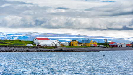 colorful wooden houses on the remote island of Vigur, on the Icelandic north western coastの写真素材