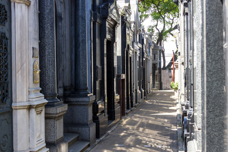 Recoleta cemetery in Buenos Aires narrow passage with shadowの写真素材