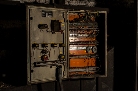 Fuse box or control panel in industrial ruinsの写真素材