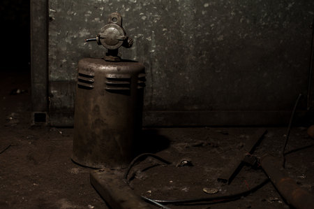 Old and rusted heavy metal part of industrial machineryの写真素材