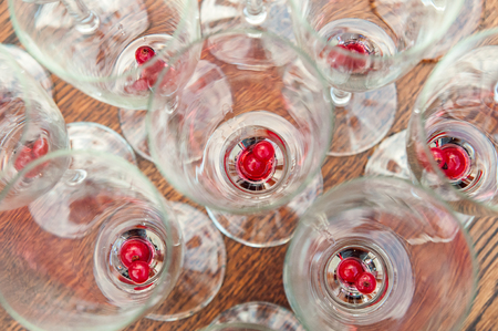 Fruits on the bottom of sparkling wine glassesの写真素材