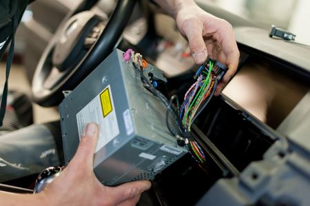 Hand of worker repair car electronic deviceの写真素材