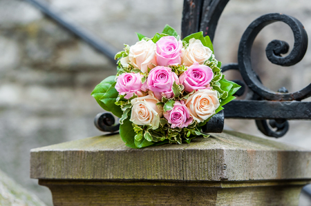 Bride bouquet on stone poleの写真素材