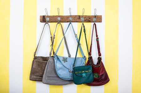 Wood wardrobe full of leather bagsの写真素材