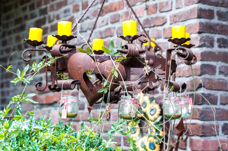 Rusty metal candleholder with chainsの写真素材