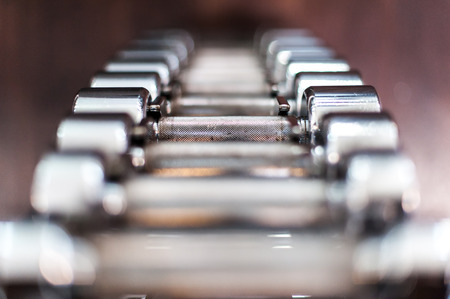 Multiple chrome dumbbells in fitness centerの写真素材