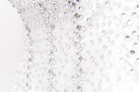 Gem stones on bride wedding dressの写真素材