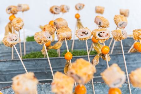 Appetizer skewer with meat and fruitsの写真素材