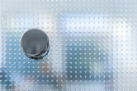 Doorknob on glass door with pattern