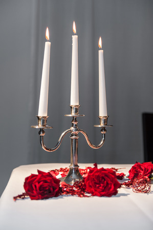 Three candles in a candle holderの写真素材