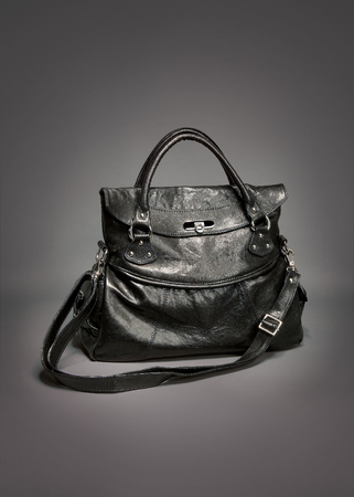 Black leather handbag on gradient gray backgroundの写真素材