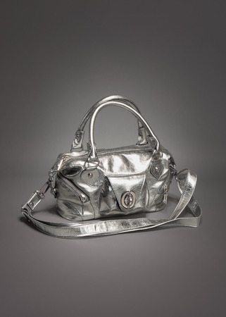 Silver purse / handbag made of leather on gradient gray backgroundの写真素材