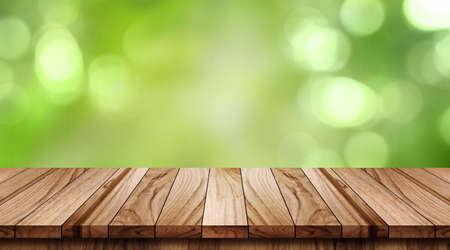 Empty wood table on blurred background copy space for montage your product or design, Blank brown board with abstract blurred backgroundの写真素材