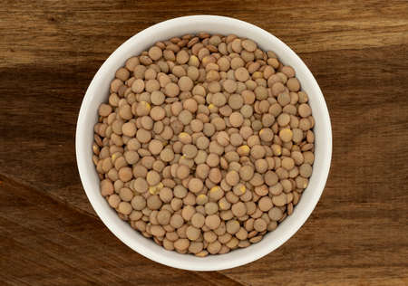 Lentils in a Ceramic Bowl. These nutritious legumes are high in protein and fiber. The image is a cut out, isolated on a white background, with a clipping path.の写真素材