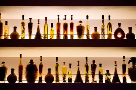 wine, and spices in colored bottles in a barの写真素材