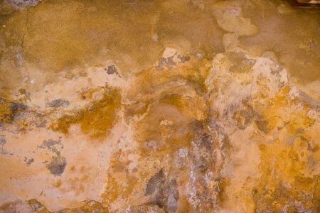 grunge wall texture in ocre color の写真素材