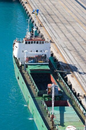 cargo boat loading in caribbean pier
