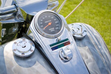 motorcycle crome dashboard with speedometer in orangeの写真素材