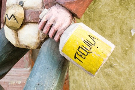 tequila bottle in cowboy handの写真素材