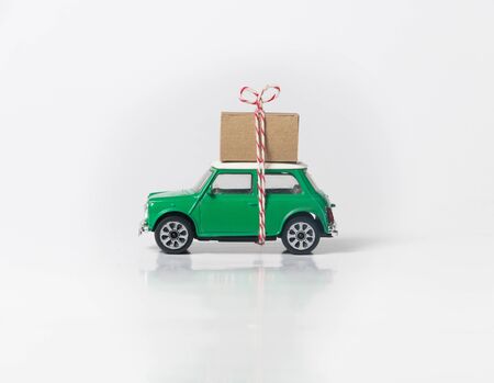 Green travel car side on whiteの写真素材