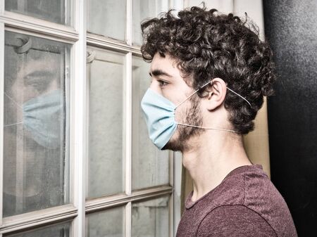 Young people seeing through a window quarantine