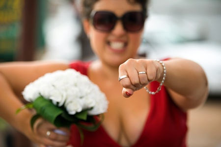 Maid of honour holdings the weddings rings for her best friends weddingの写真素材