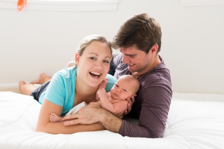 happy parents with their newborn baby boy の写真素材