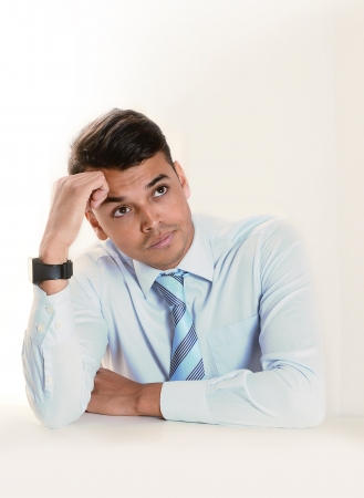 Young good looking business Man thinking doubtful and pensive  isolated on clear backgroundの写真素材