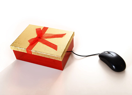  Computer Mouse conected to Christmas Present representing online shoppingの写真素材